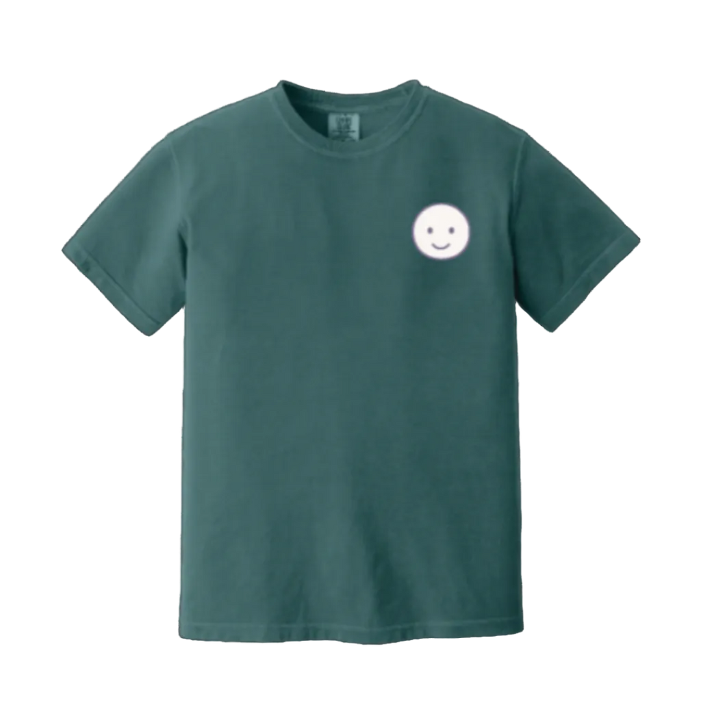 Green t-shirt with a smiley face design on a white background