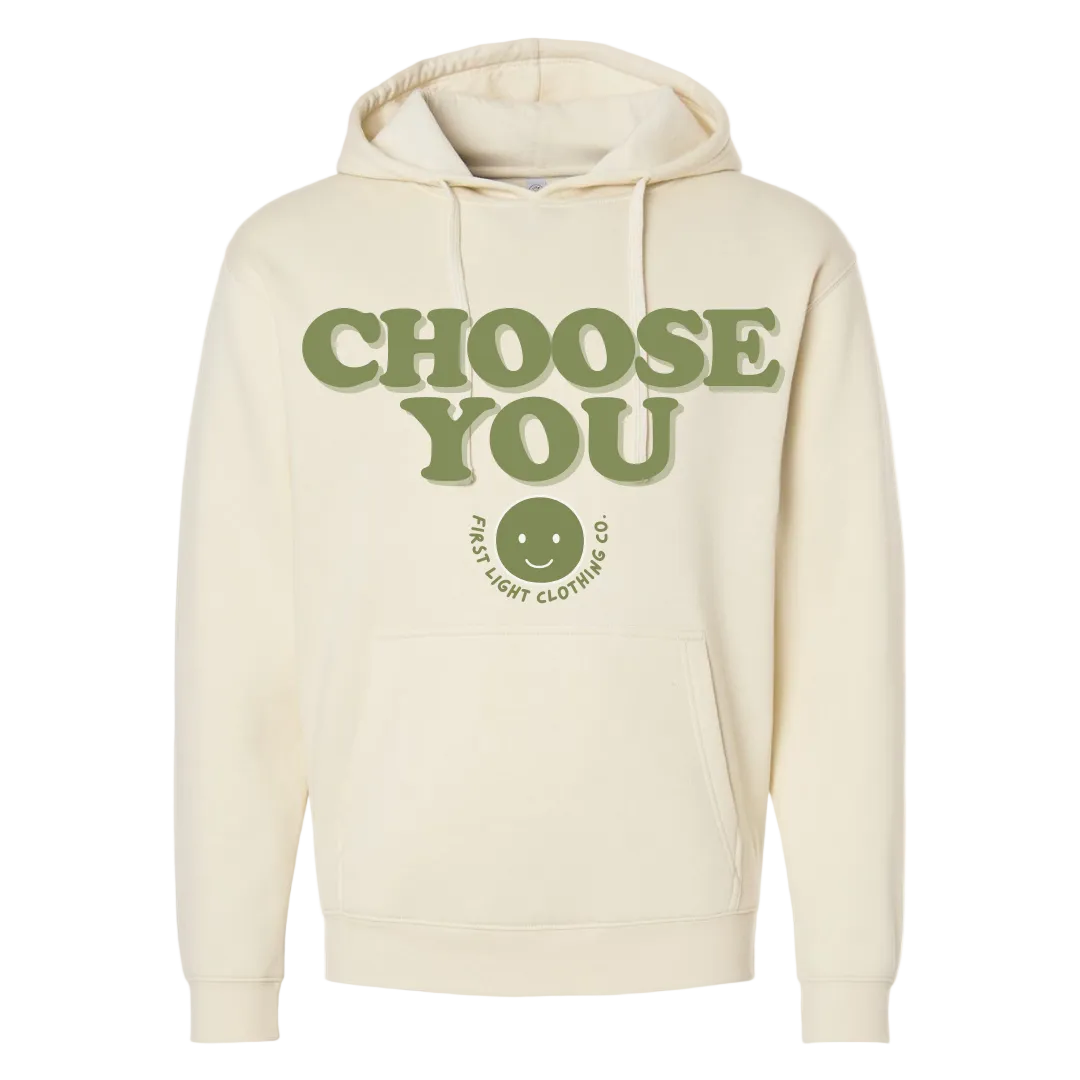 Beige hoodie with 'CHOOSE YOU' text and smiley face logo on a white background