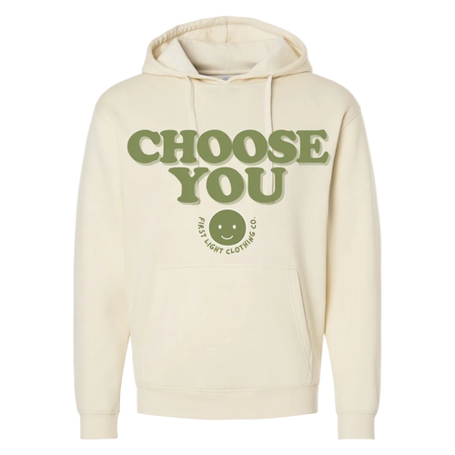 Beige hoodie with 'CHOOSE YOU' text and smiley face logo on a white background