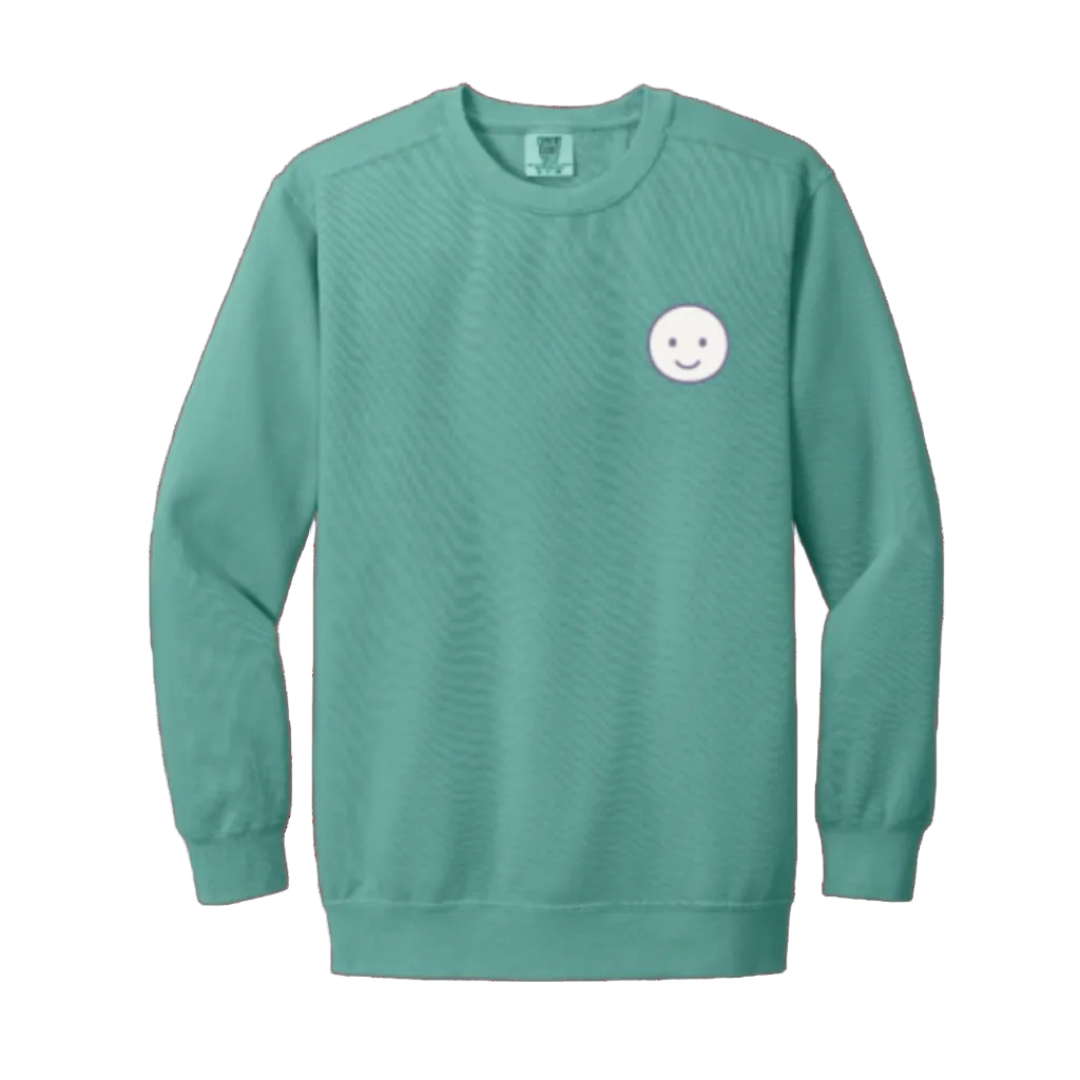 Seafoam sweatshirt with a smiley face design on a white background