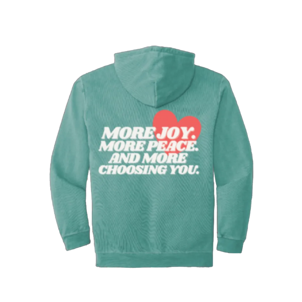 Seafoam hoodie with text and heart design on the back against a white background