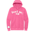 Pink hoodie with 'feel me up' text and a pink ribbon on a white background