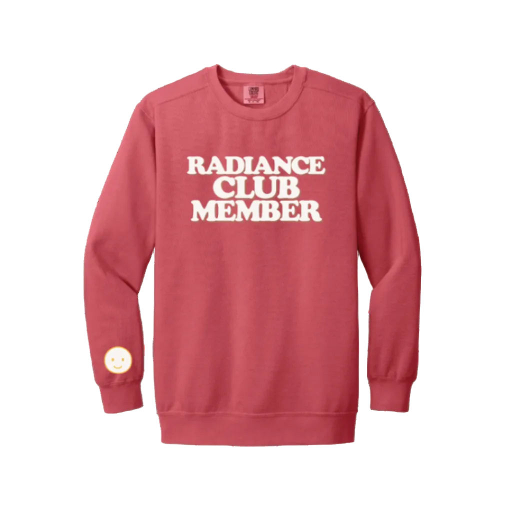 Red sweatshirt with 'Radiance Club Member' text on a white background