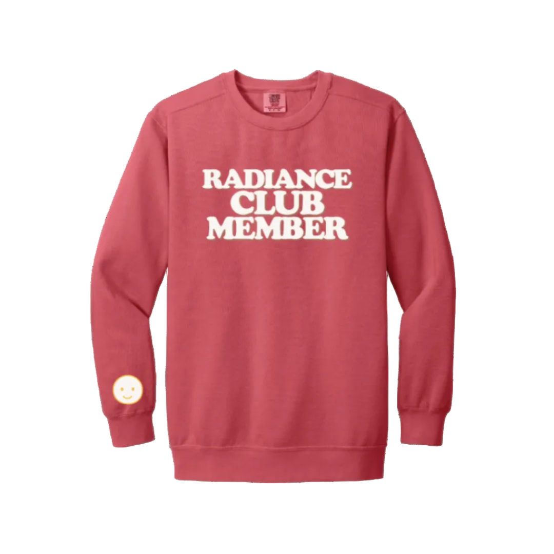 Red sweatshirt with 'Radiance Club Member' text on a white background