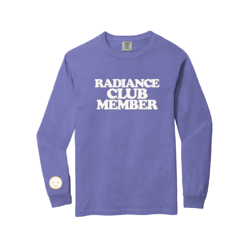 Purple long-sleeve shirt with 'Radiance Club Member' text on a white background