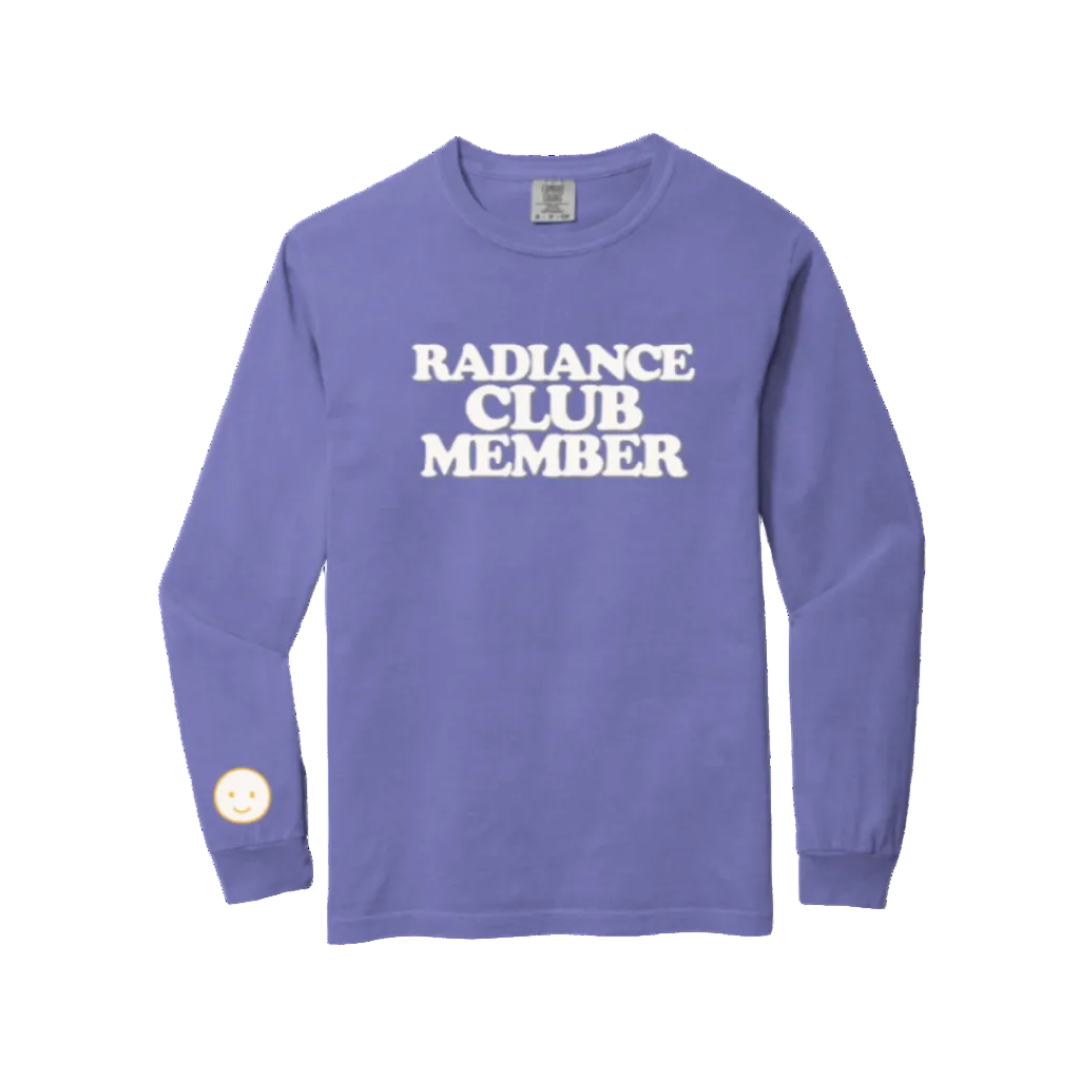 Purple long-sleeve shirt with 'Radiance Club Member' text on a white background