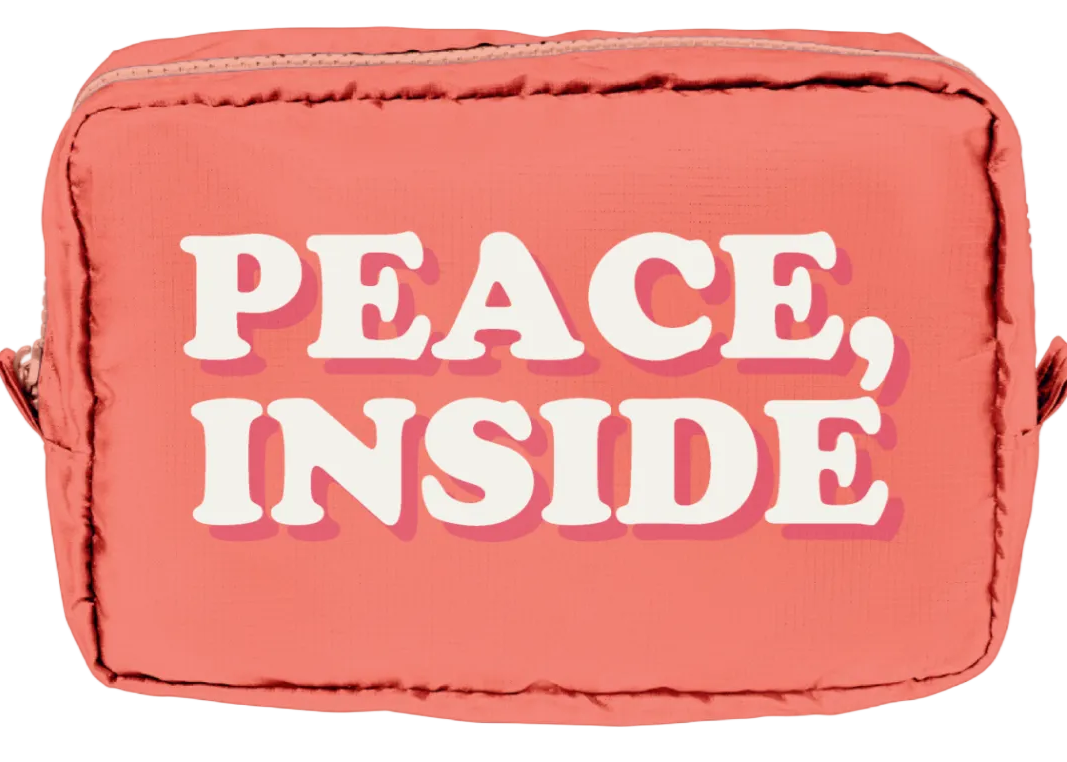 Pink pouch with 'PEACE, INSIDE' text on a white background