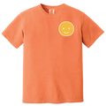 Orange t-shirt with a yellow smiley face on a white background
