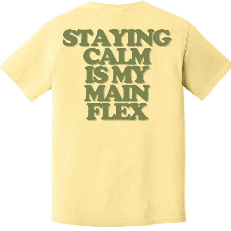 Yellow t-shirt with text 'STAYING CALM IS MY MAIN FLEX' on the back against a white background