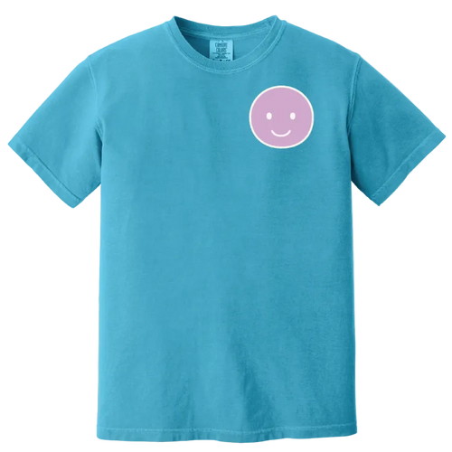 Blue t-shirt with a pink smiley face design on a white background