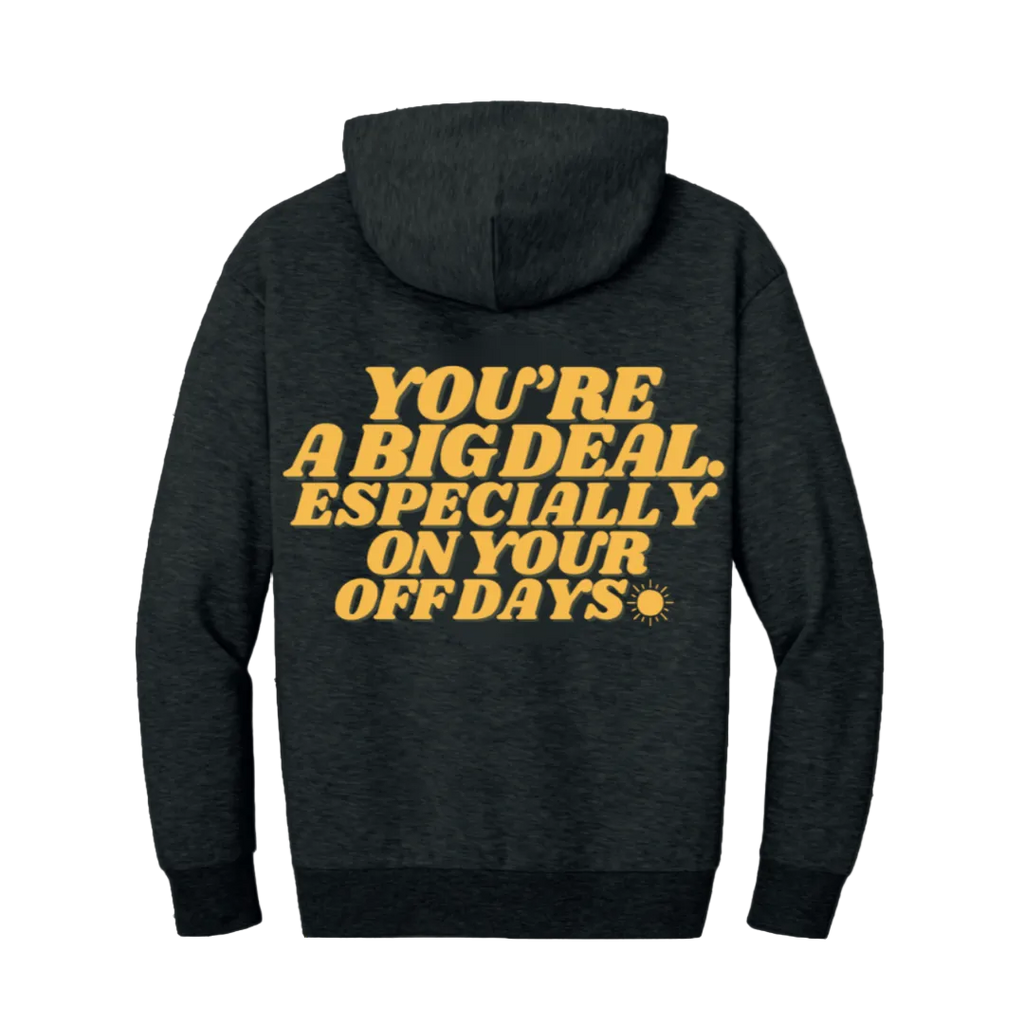 Black hoodie with yellow text on a white background