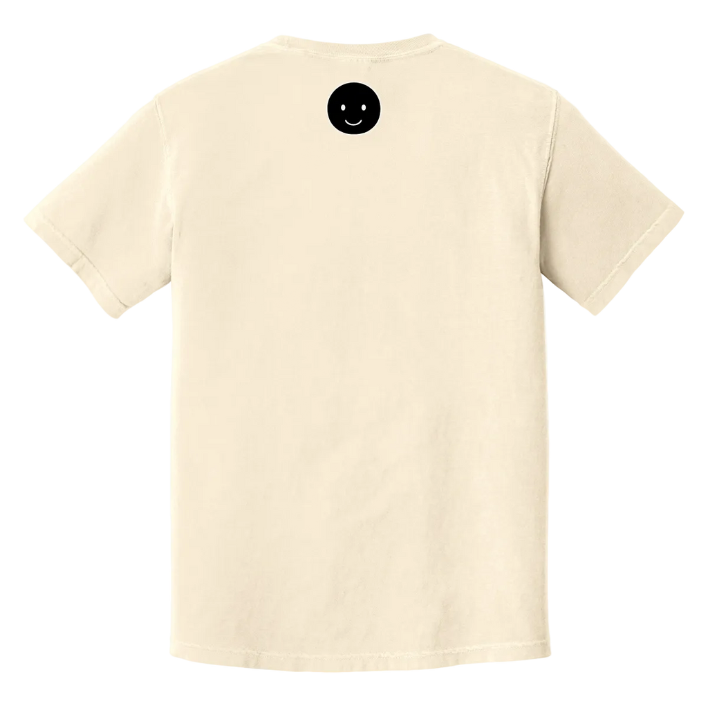 Beige t-shirt with a black smiley face button on a white background