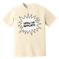Beige t-shirt with 'Show Up Anyways' text on a white background